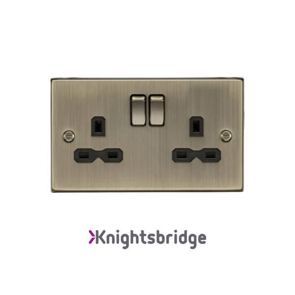 Brass electrical socket with two sockets and two switches on a white background, branded 'Knightsbridge'.