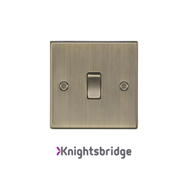 Brass light switch with 'Knightsbridge' branding on a white background