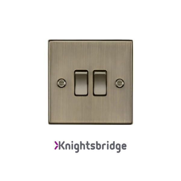 Brass light switch with 'Knightsbridge' branding on a white background